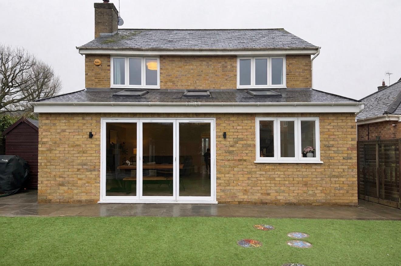 Two-storey rear extension with dormer windows and bifold doors